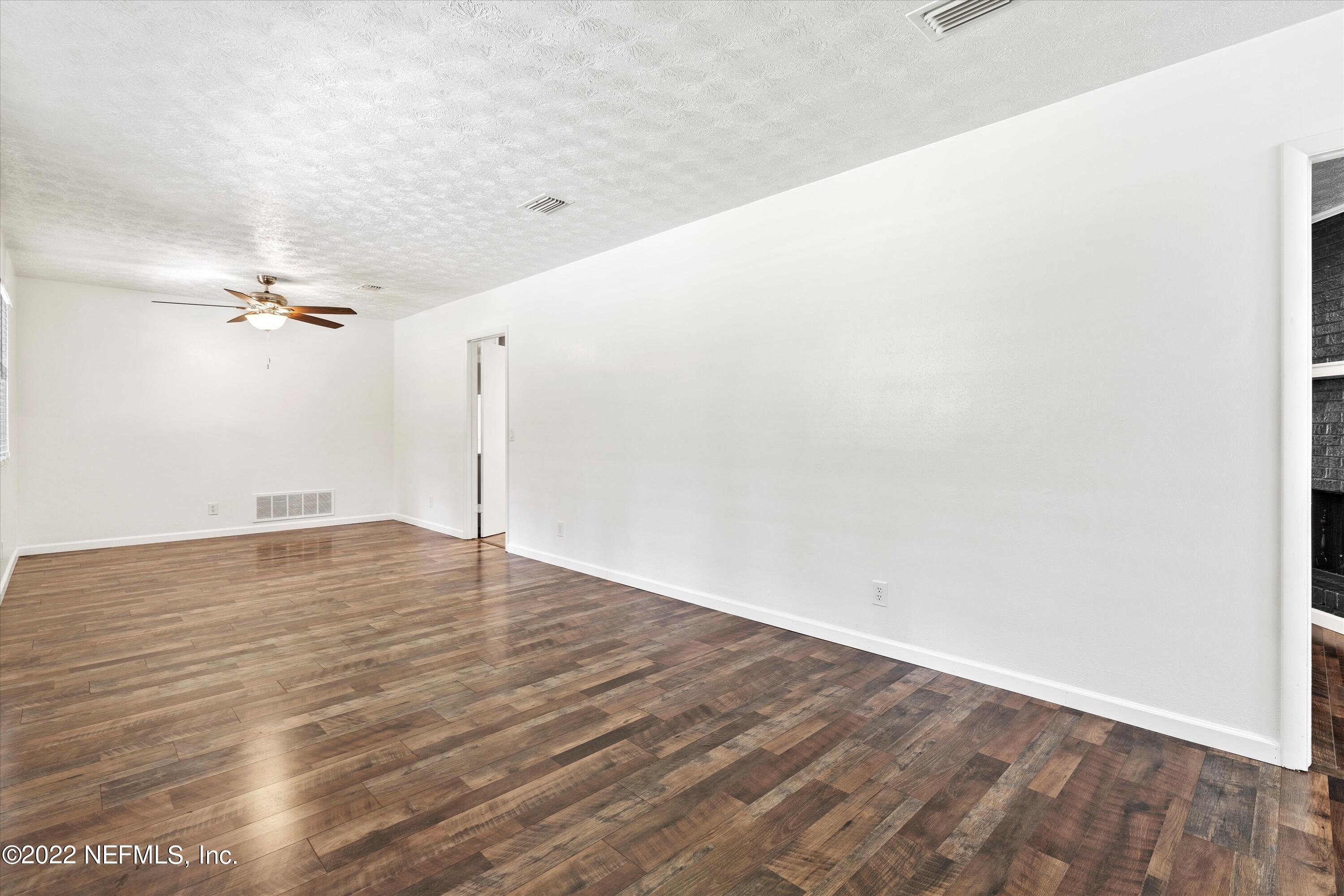 5092 Harvey Grant Road Fleming Island, FL 32003 - Photo 12 of 38 a view of a room with wooden floor