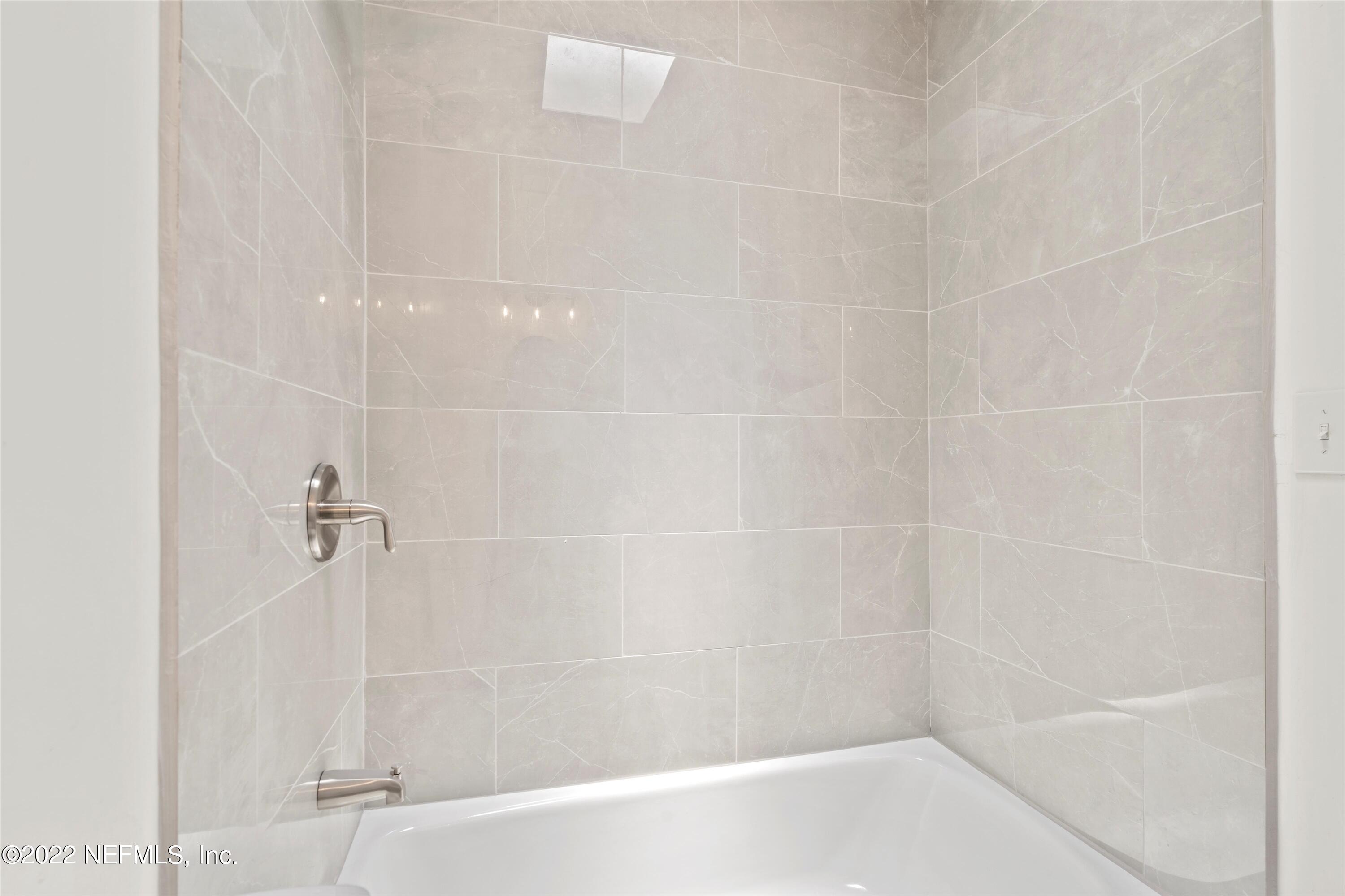 5092 Harvey Grant Road Fleming Island, FL 32003 - Photo 27 of 38 a close up of a bathtub