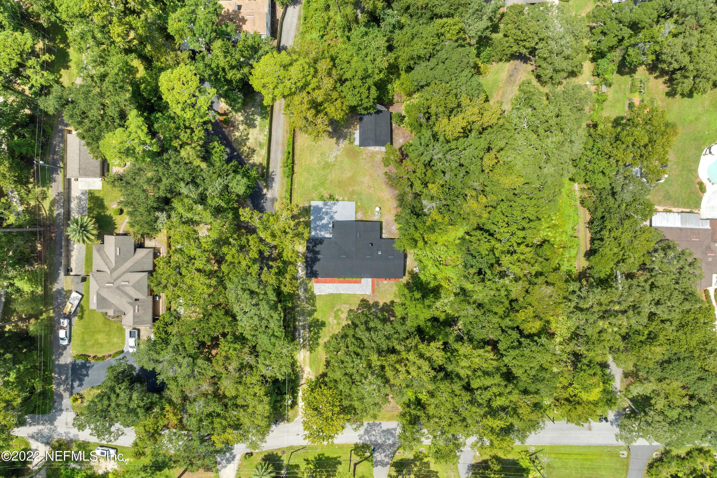 5092 Harvey Grant Road Fleming Island, FL 32003 - Photo 31 of 38 a view of a large yard with plants and large trees