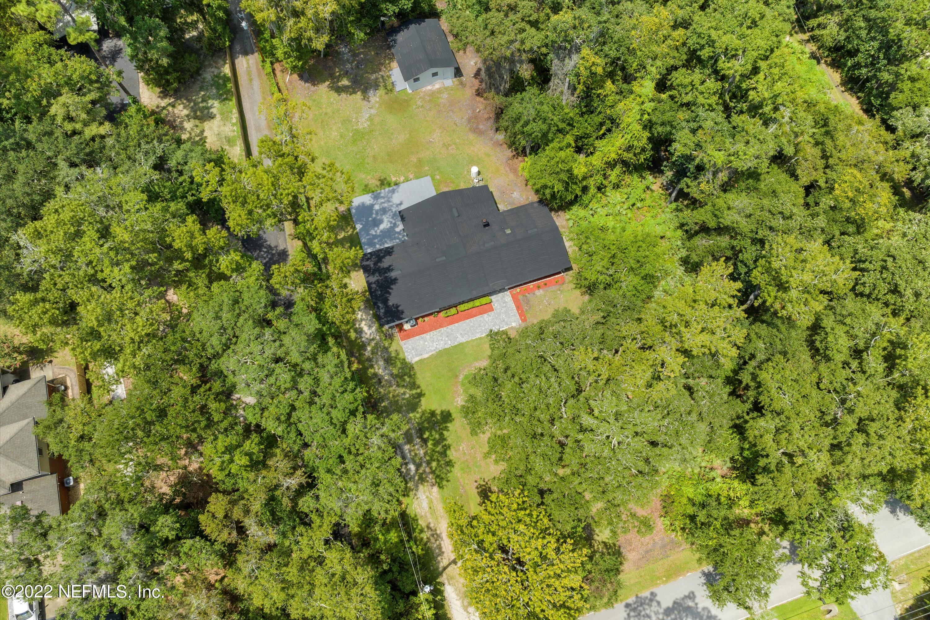 5092 Harvey Grant Road Fleming Island, FL 32003 - Photo 32 of 38 an aerial view of a house with a yard