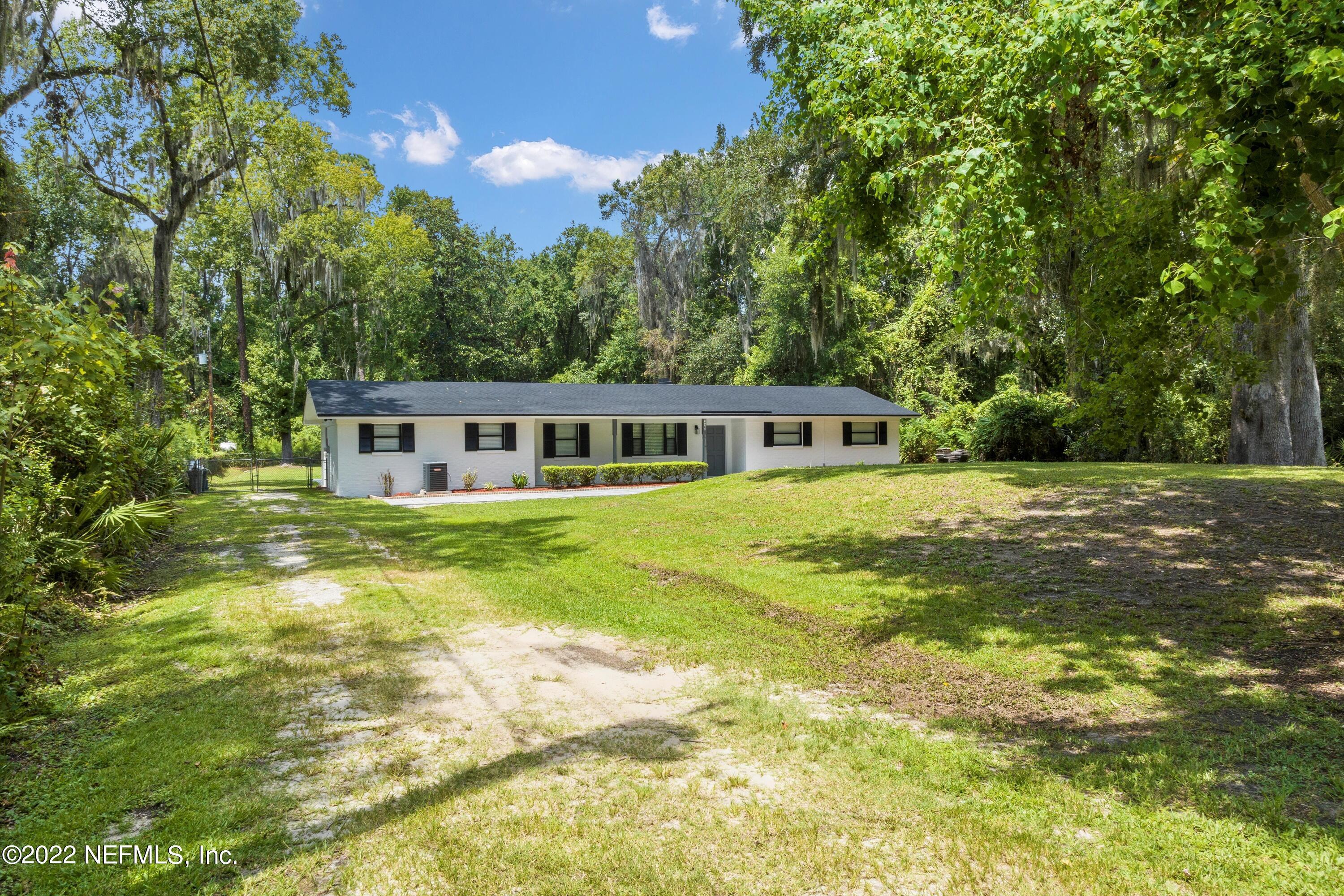 5092 Harvey Grant Road Fleming Island, FL 32003 - Photo 33 of 38 a view of a house with a yard