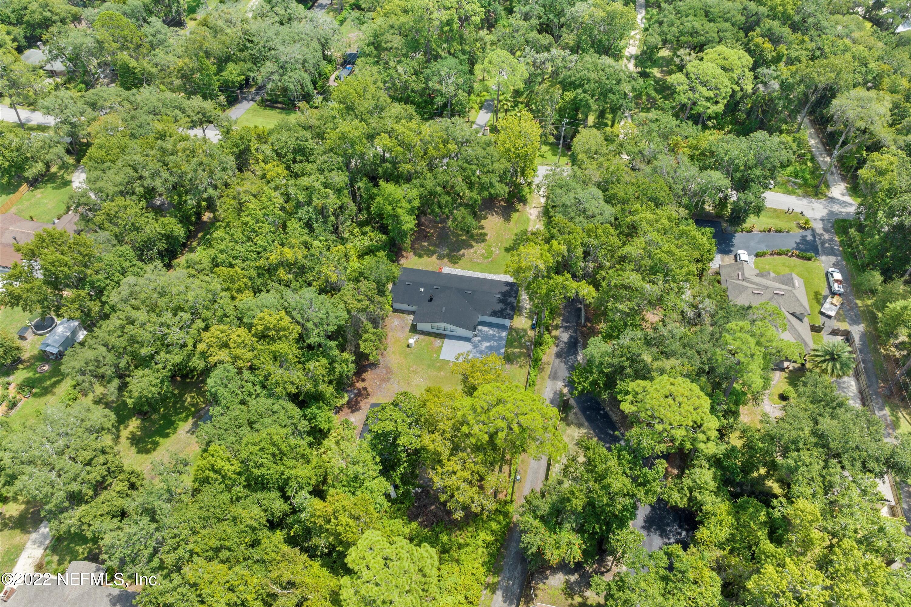 5092 Harvey Grant Road Fleming Island, FL 32003 - Photo 34 of 38 an aerial view of a house with a yard