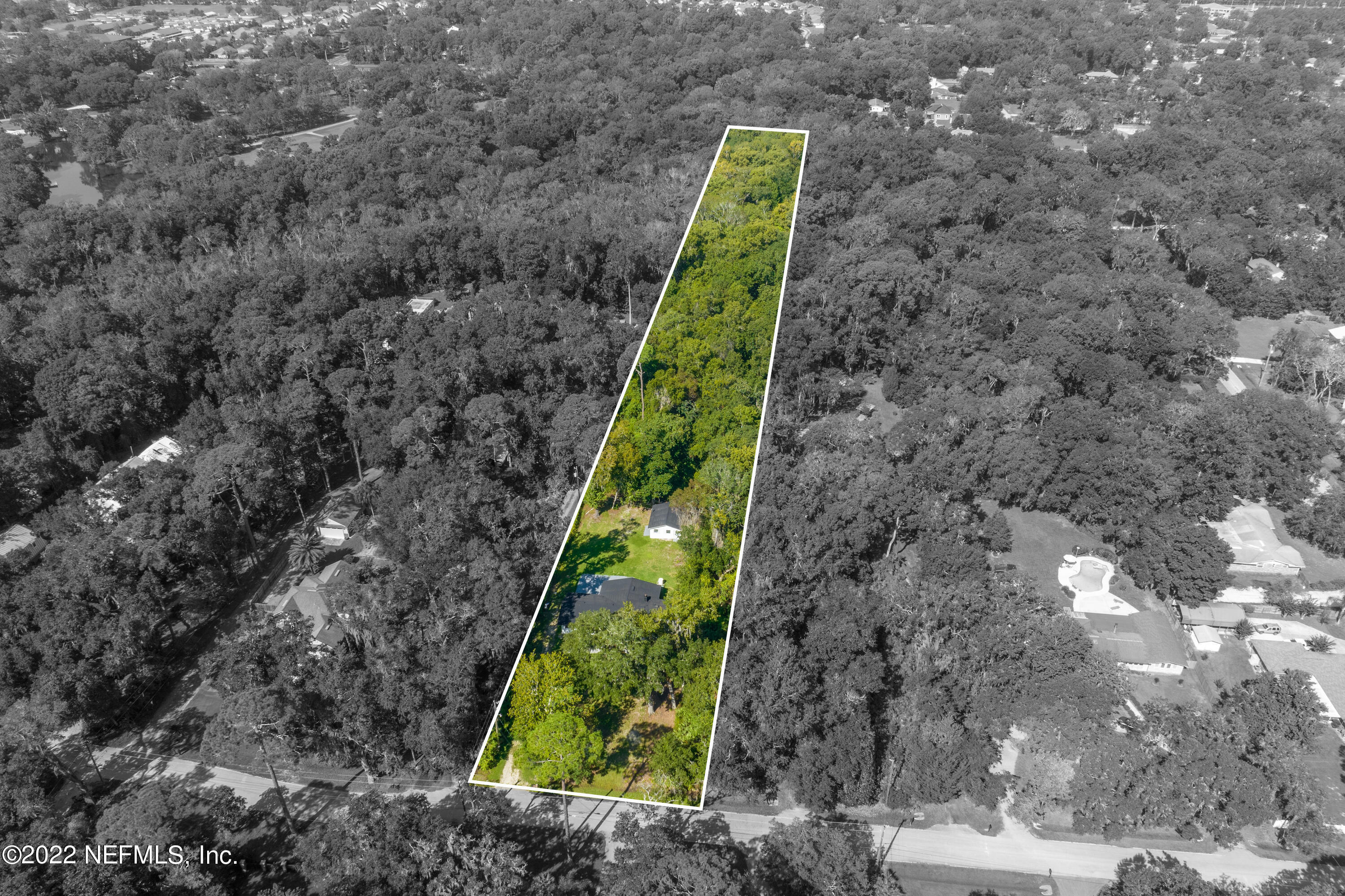 5092 Harvey Grant Road Fleming Island, FL 32003 - Photo 35 of 38 a view of a yard with plants