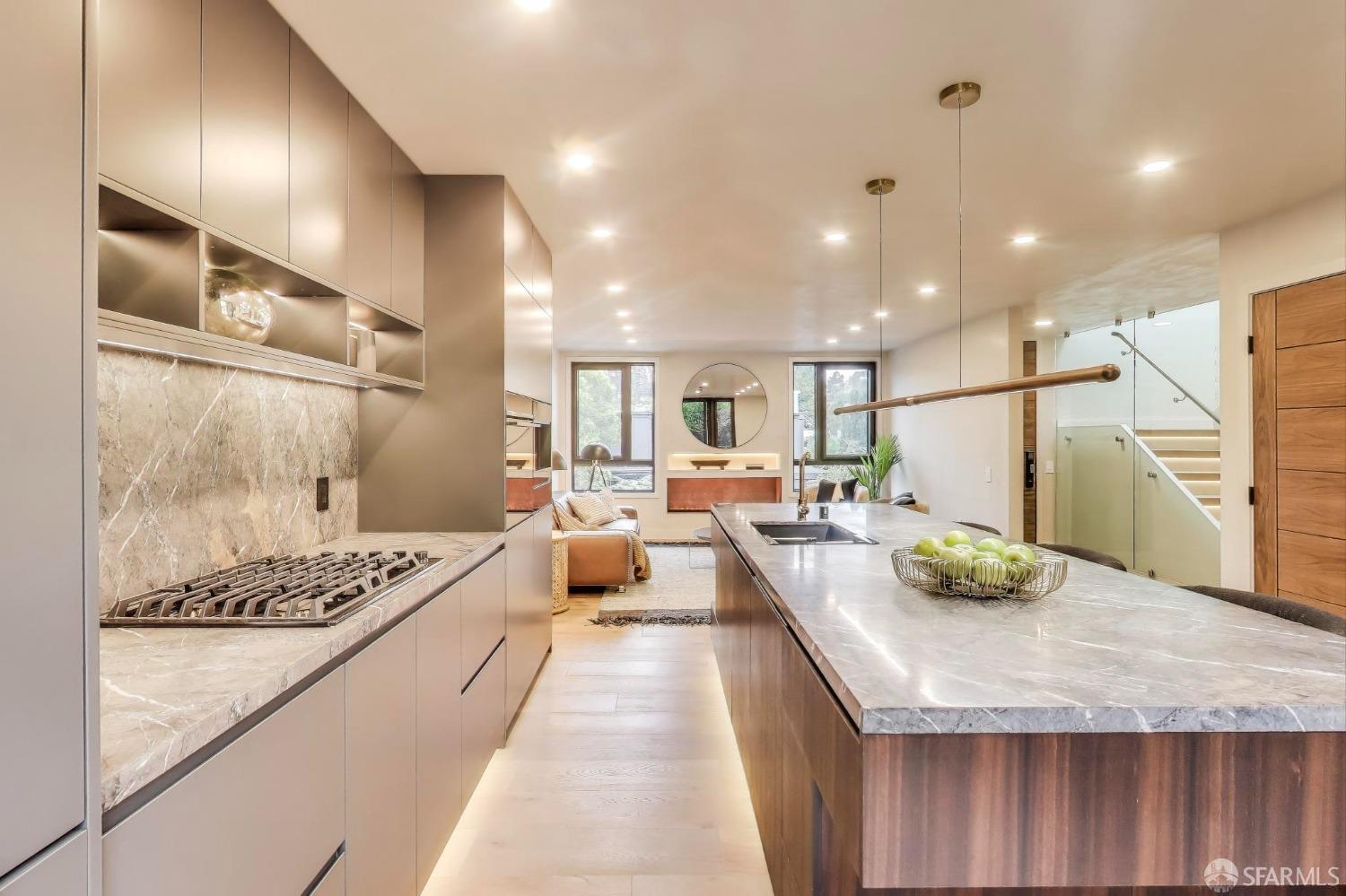 45 Turquoise Way San Francisco, CA 94131 - Photo 12 of 87 a large kitchen with a counter space a sink stainless steel appliances and cabinets