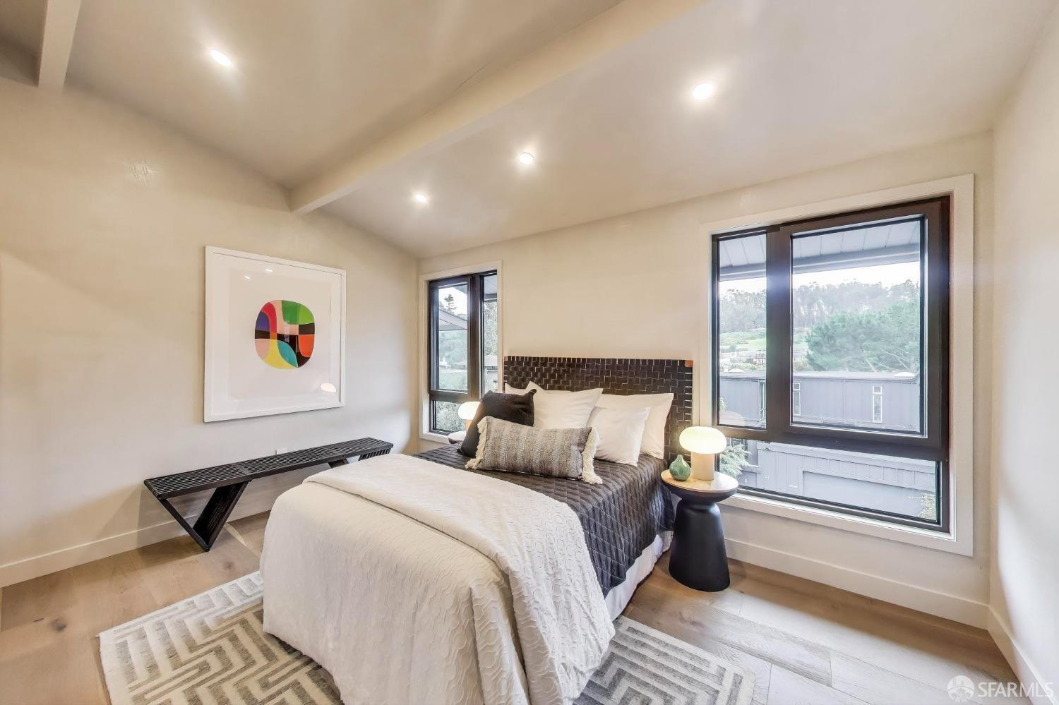 45 Turquoise Way San Francisco, CA 94131 - Photo 42 of 87 a bedroom with a bed and a large window