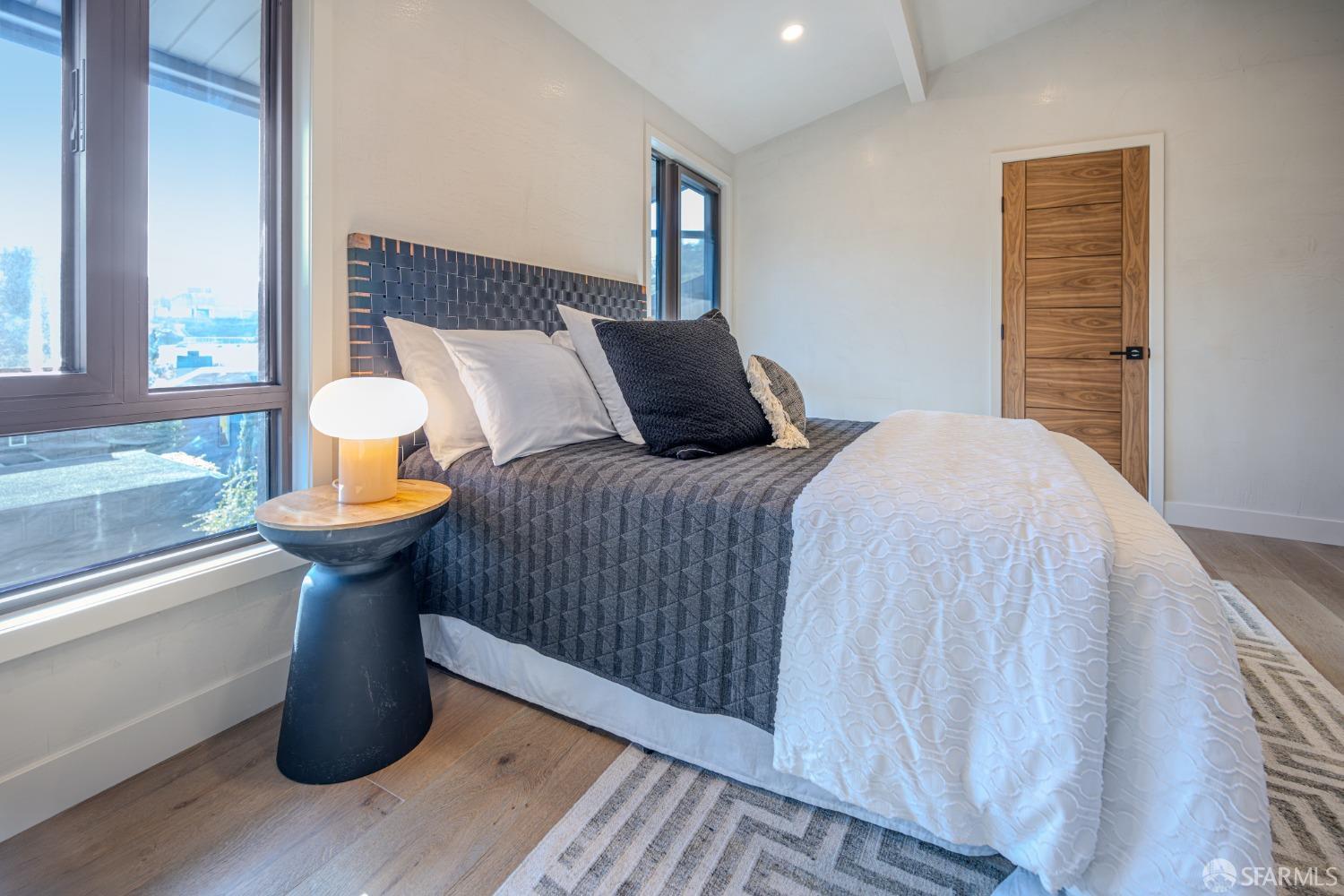 45 Turquoise Way San Francisco, CA 94131 - Photo 44 of 87 a bedroom with a bed and wooden floor