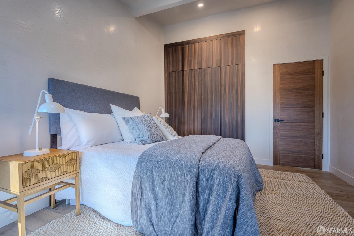 45 Turquoise Way San Francisco, CA 94131 - Photo 46 of 87 a bedroom with a bed and a chair