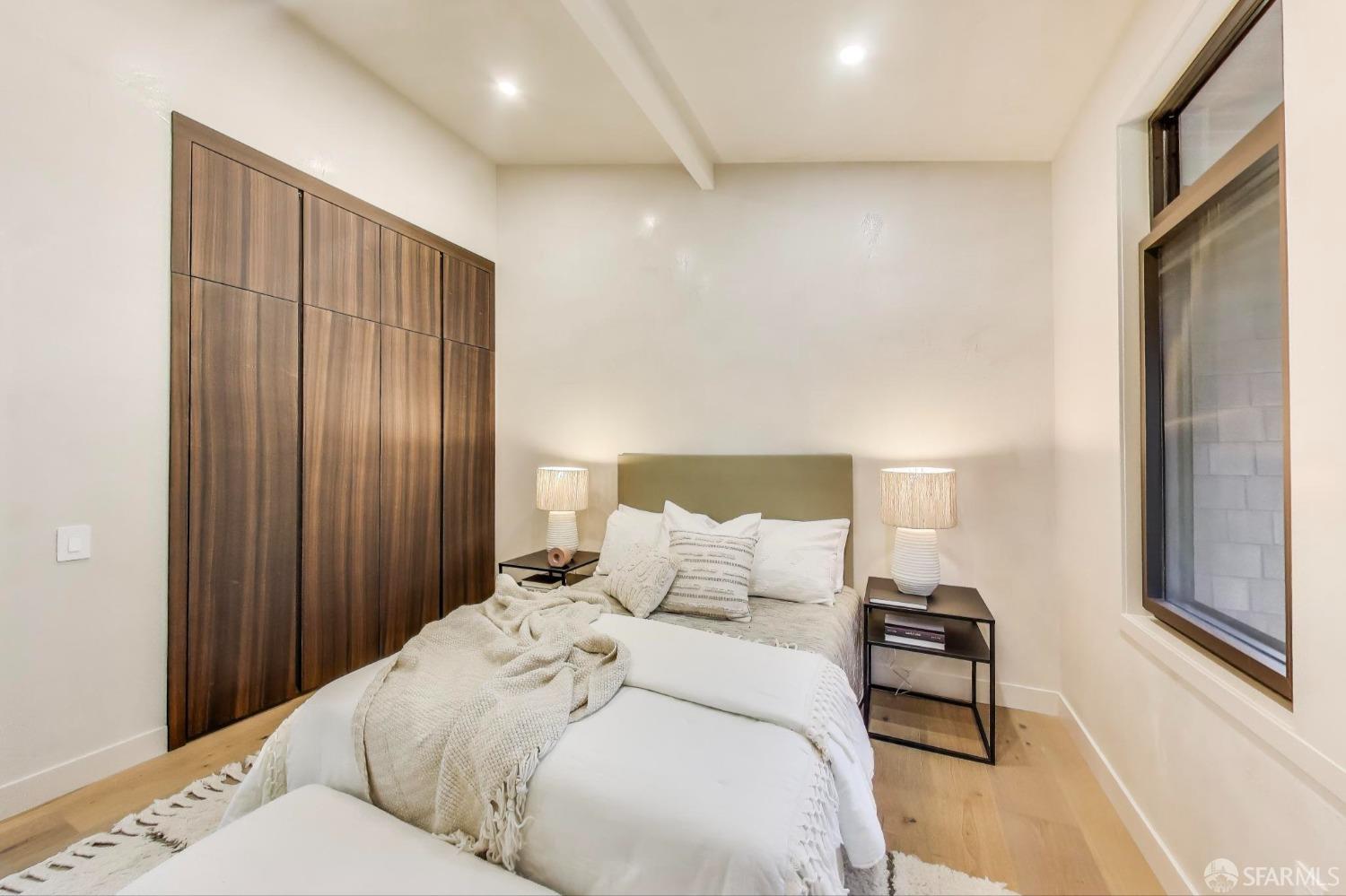 45 Turquoise Way San Francisco, CA 94131 - Photo 47 of 87 a bedroom with a bed and a night stand