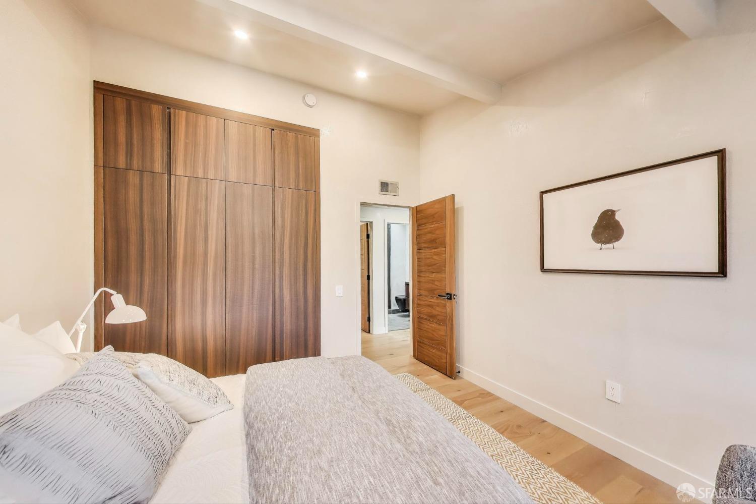 45 Turquoise Way San Francisco, CA 94131 - Photo 49 of 87 a bedroom with a bed and a painting on the wall