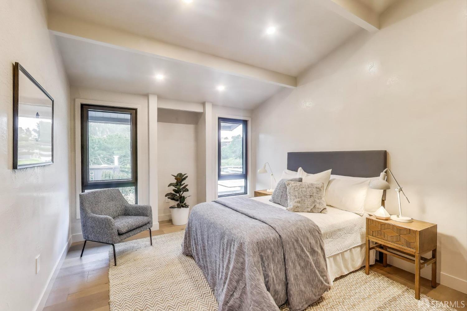 45 Turquoise Way San Francisco, CA 94131 - Photo 50 of 87 a bedroom with a large bed and couches