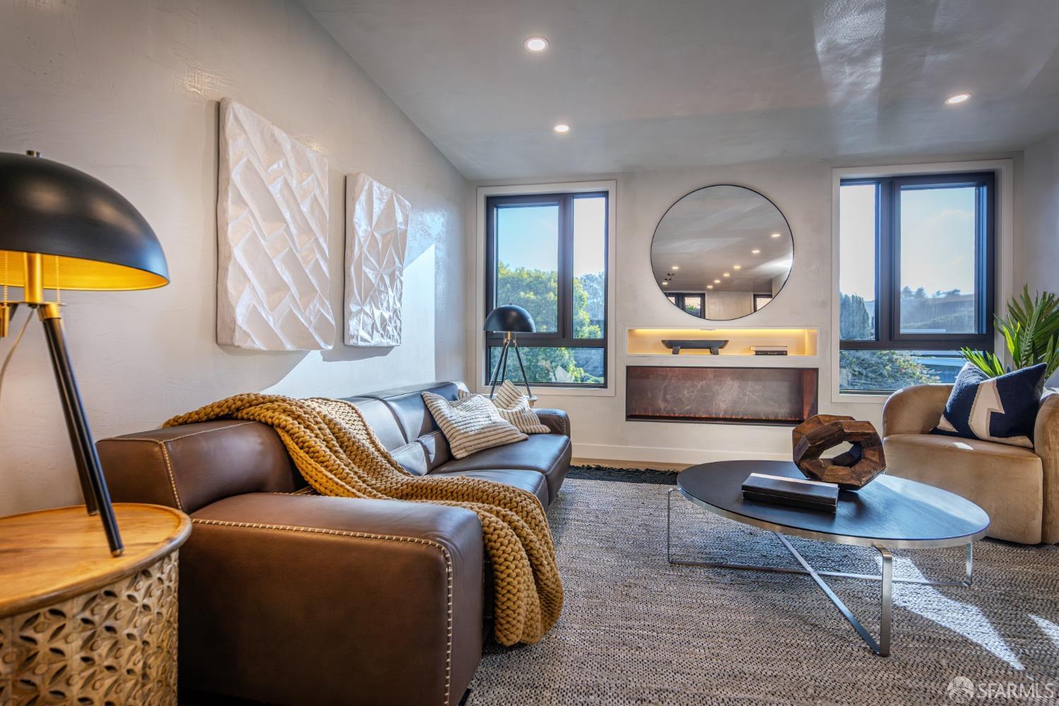 45 Turquoise Way San Francisco, CA 94131 - Photo 5 of 87 a living room with furniture a rug and a large window