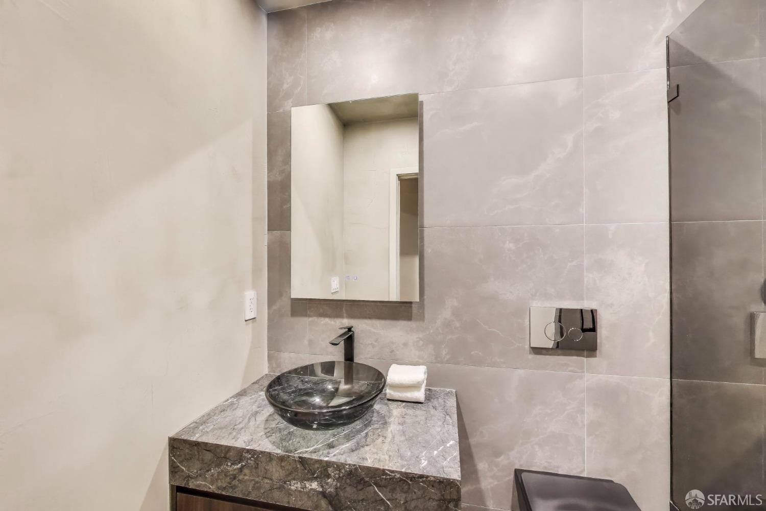 45 Turquoise Way San Francisco, CA 94131 - Photo 62 of 87 a bathroom with sink and mirror