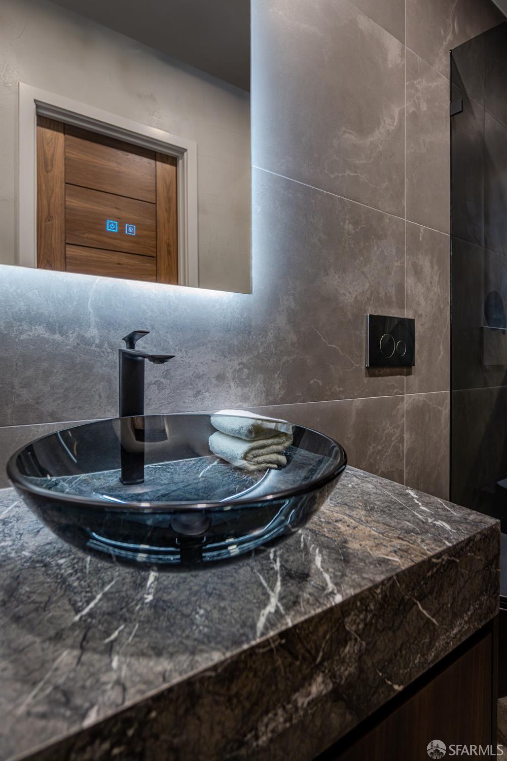 45 Turquoise Way San Francisco, CA 94131 - Photo 65 of 87 a bathroom with a sink and a mirror