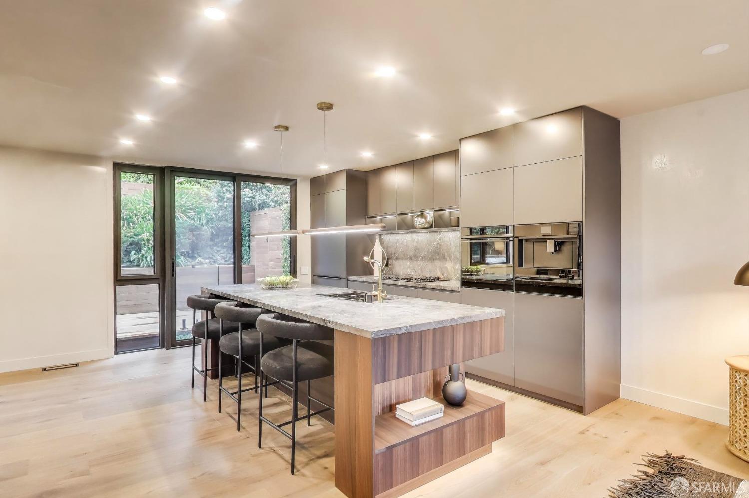 45 Turquoise Way San Francisco, CA 94131 - Photo 9 of 87 a kitchen with stainless steel appliances kitchen island granite countertop a sink and cabinets
