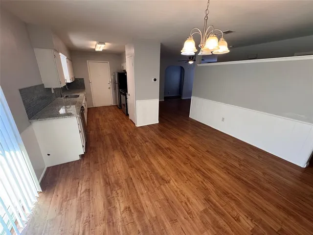 a view of a kitchen from the hallway