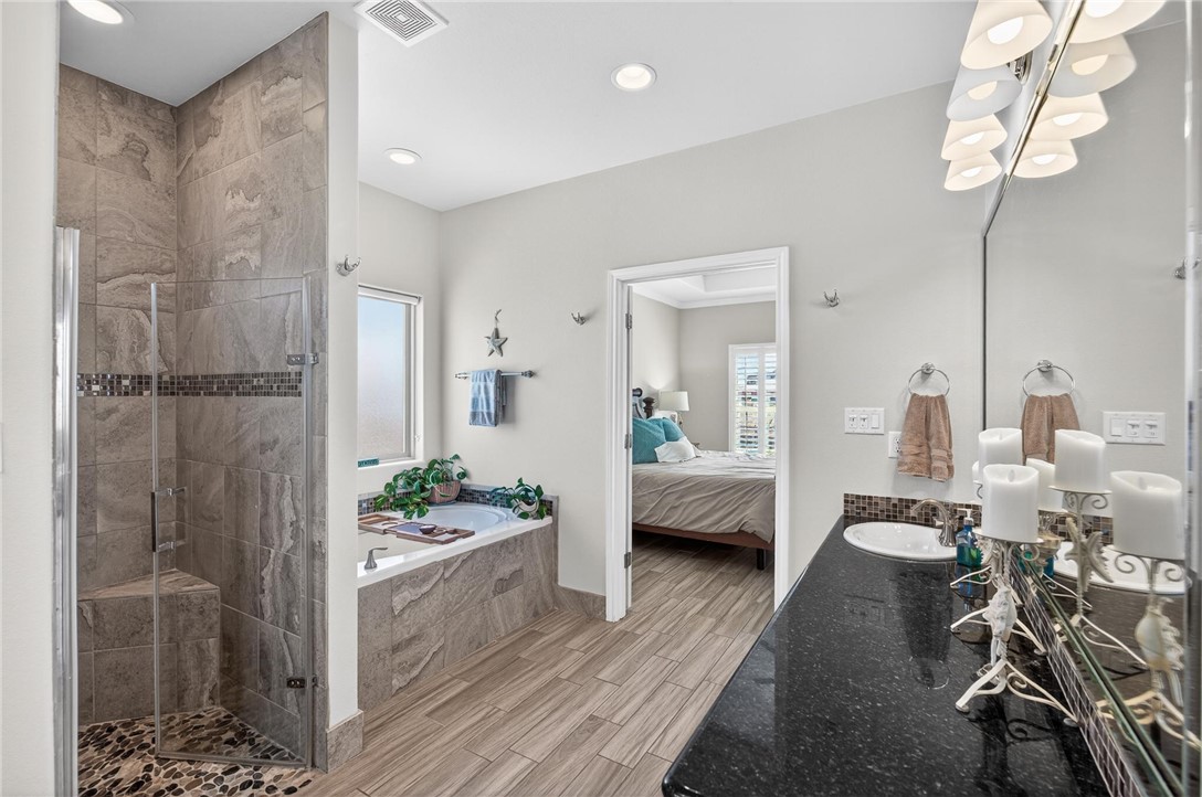 15614 Cuttysark Street Corpus Christi, TX 78418 - Photo 25 of 40 Primary Bath w/ walk in shower and large garden tu