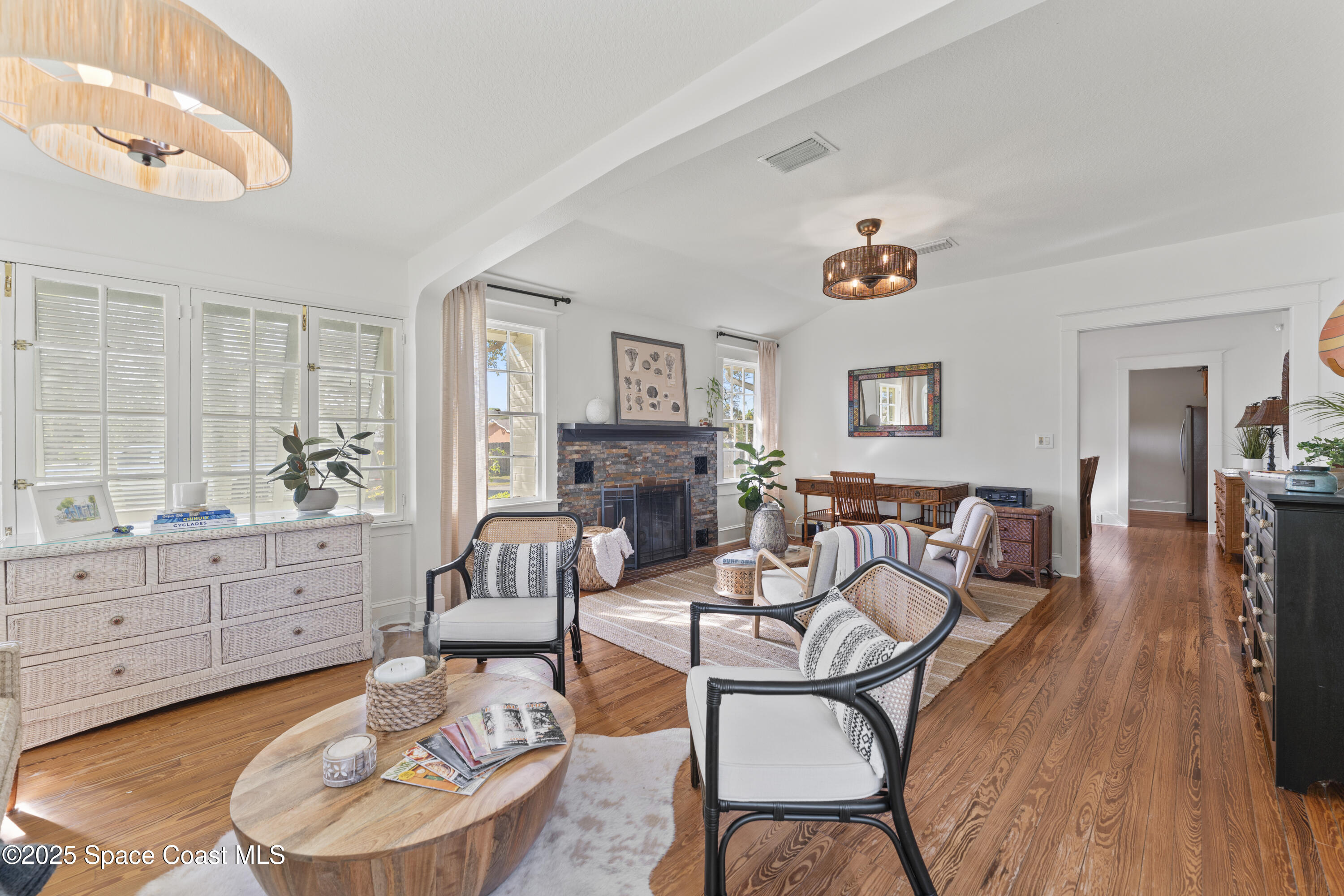 346 3rd Avenue Indialantic, FL 32903 - Photo 12 of 47 a living room with fireplace furniture and a wooden floor