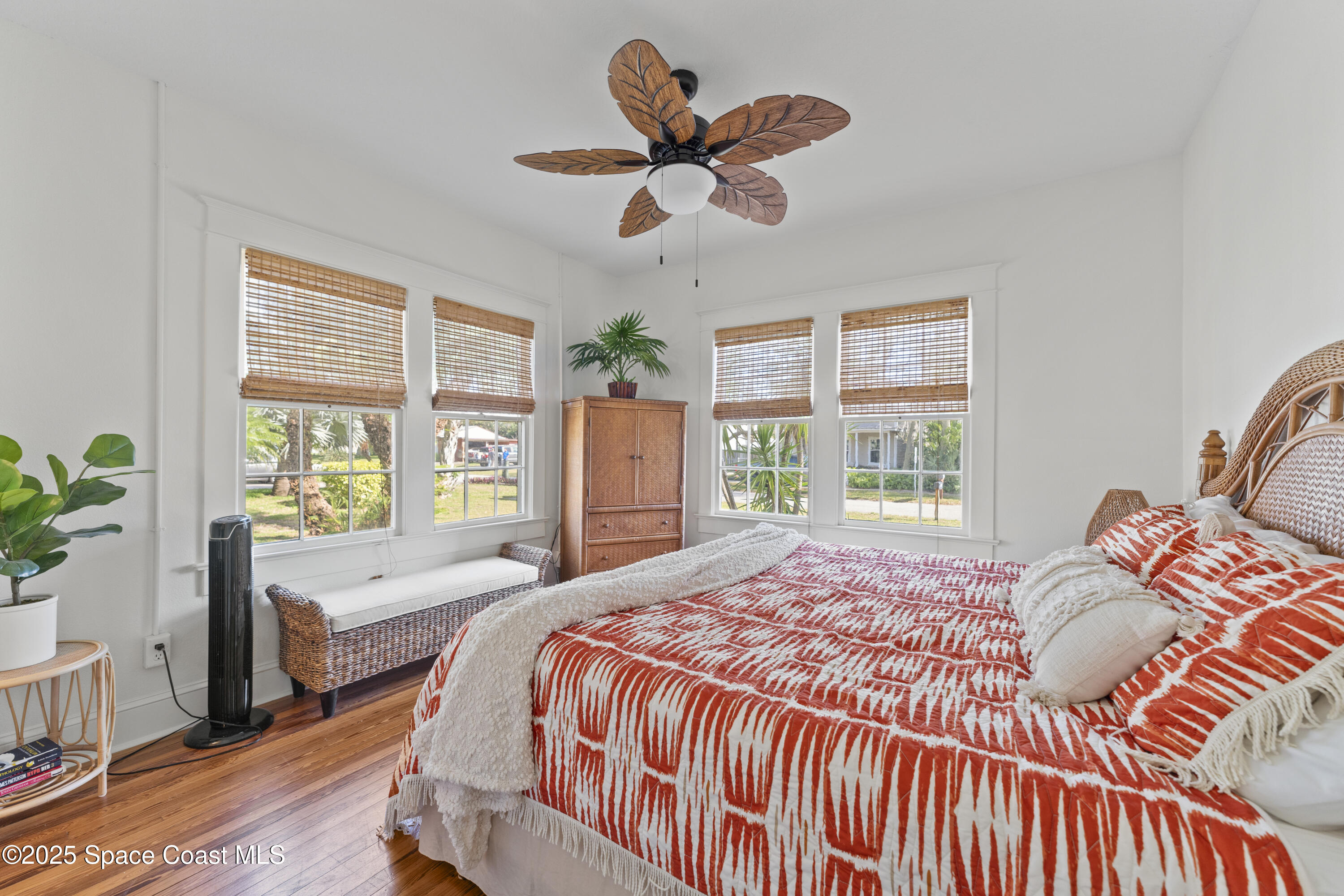 346 3rd Avenue Indialantic, FL 32903 - Photo 20 of 47 a bedroom with a large bed and a chandelier