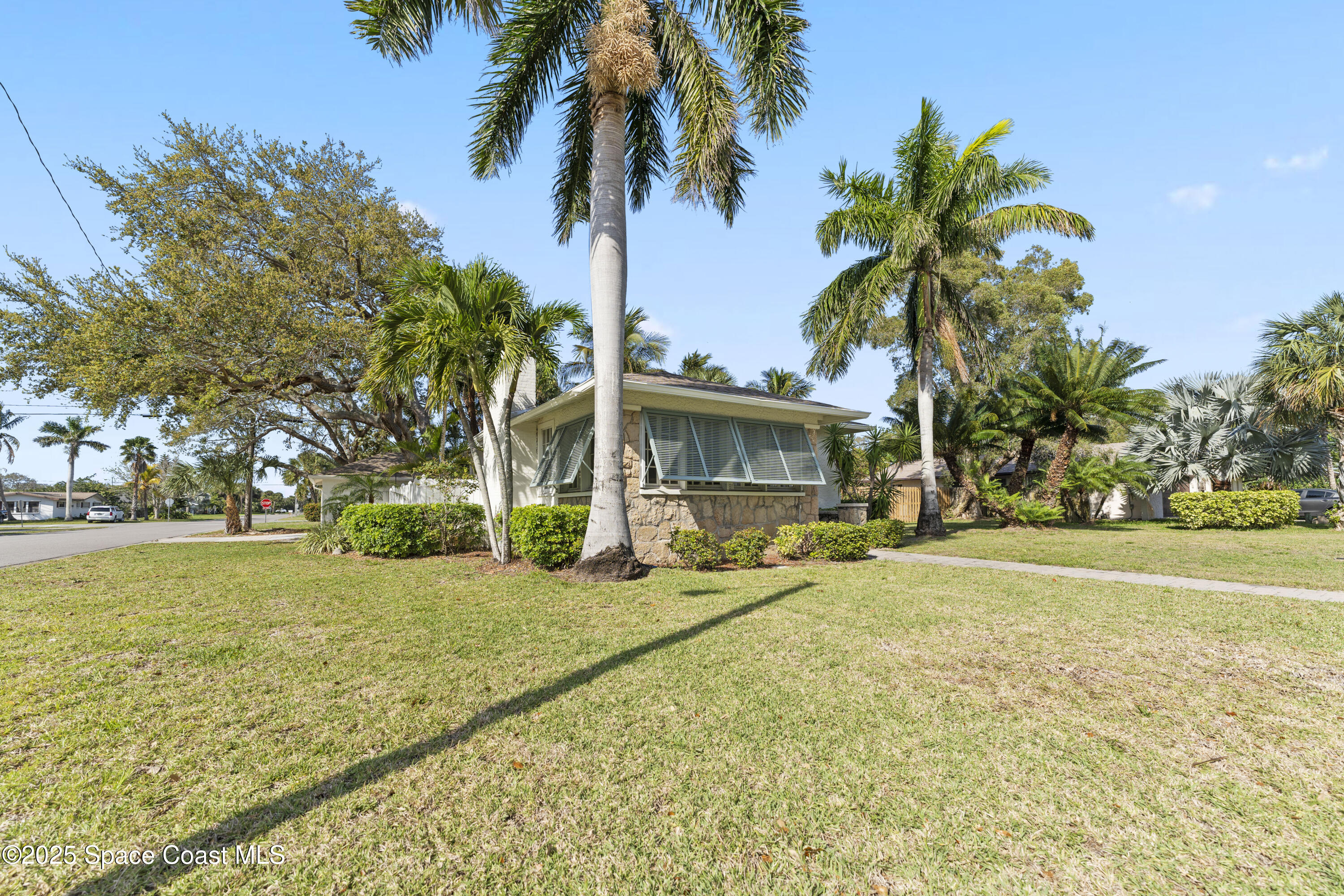 346 3rd Avenue Indialantic, FL 32903 - Photo 2 of 47 a view of a house with a swimming pool and a trees