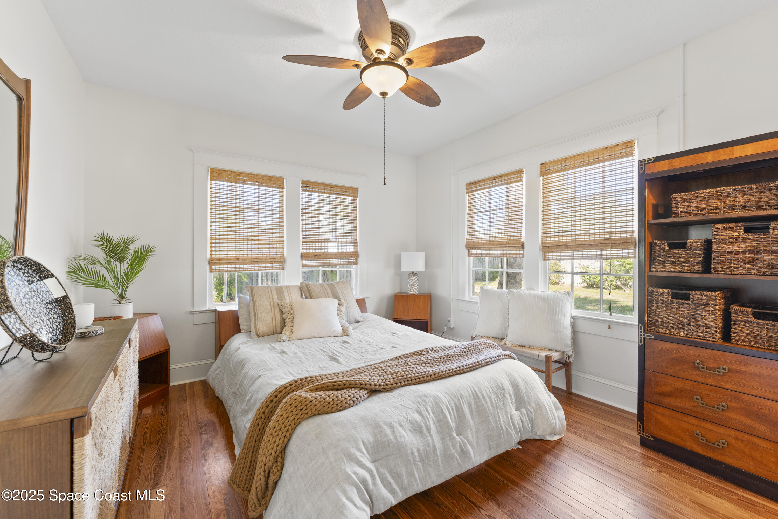 346 3rd Avenue Indialantic, FL 32903 - Photo 23 of 47 a bedroom with a bed cabinets and a large window
