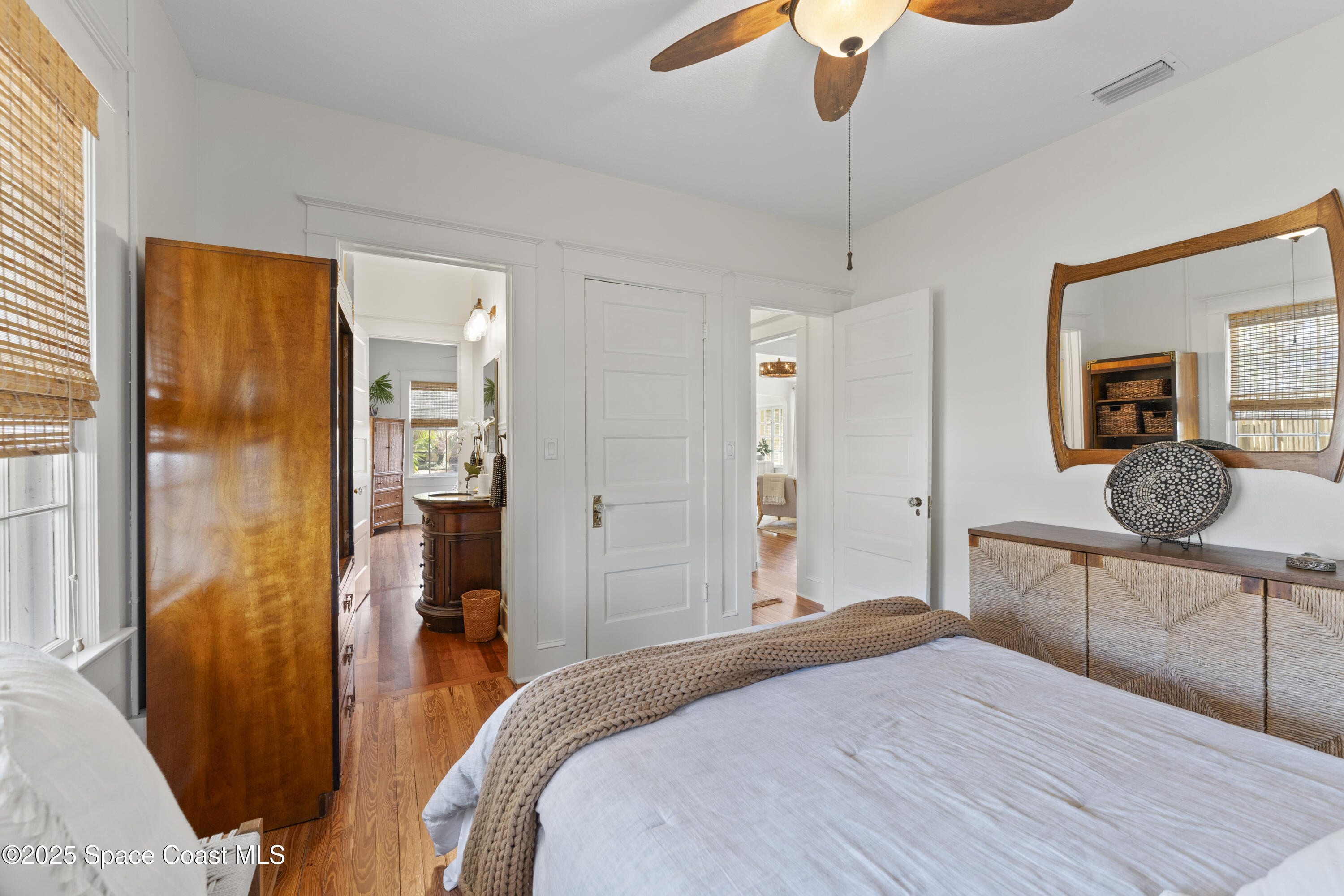 346 3rd Avenue Indialantic, FL 32903 - Photo 24 of 47 a bedroom with a bed and a chandelier