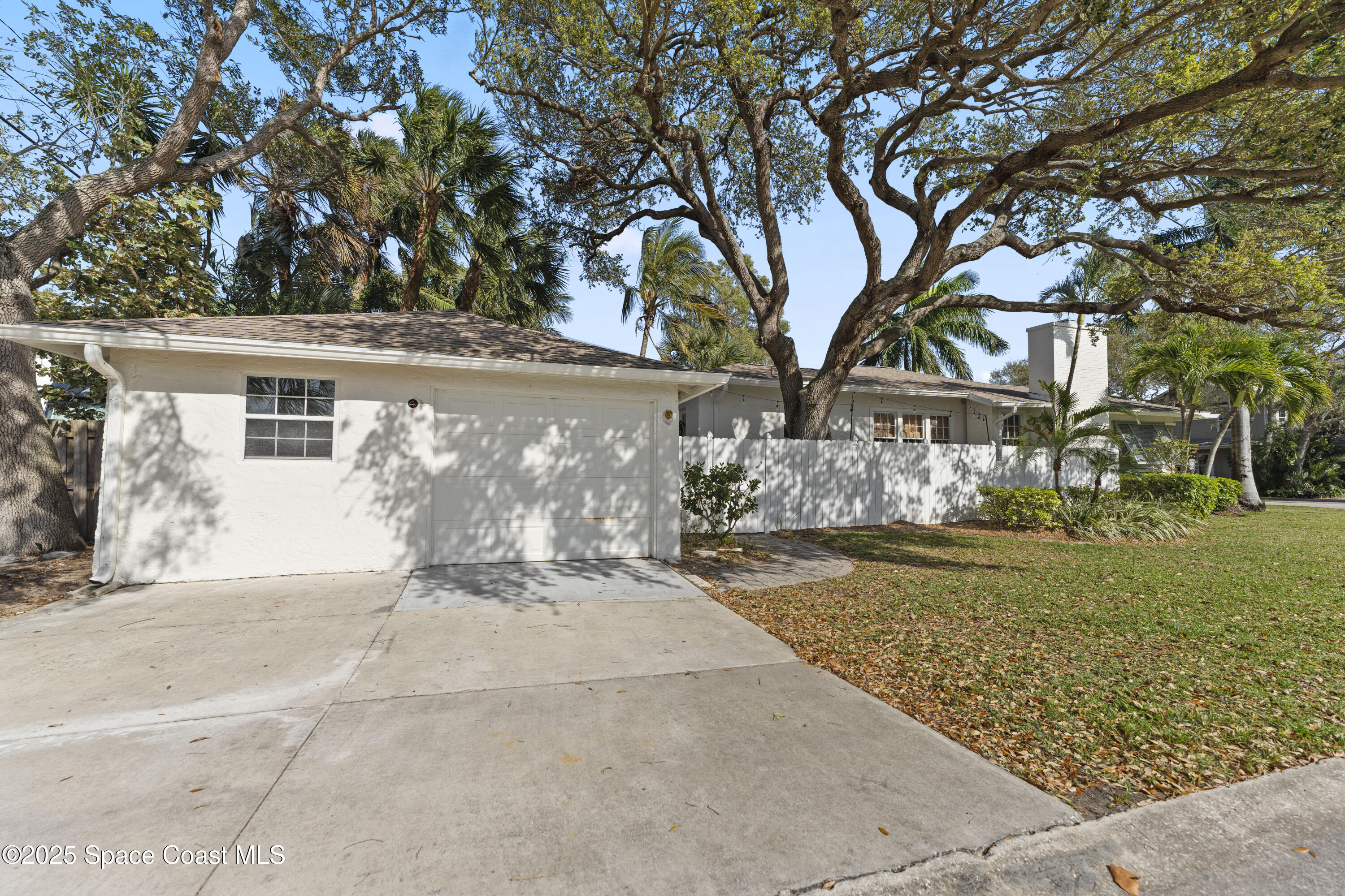 346 3rd Avenue Indialantic, FL 32903 - Photo 9 of 47 front view of a house with a yard