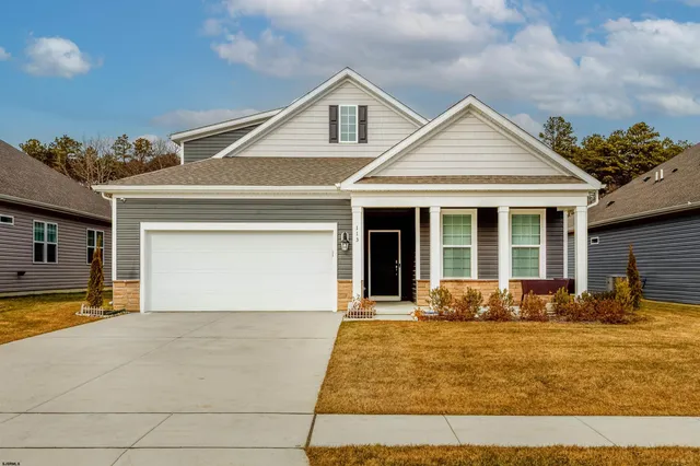 a front view of a house with a outdoor space