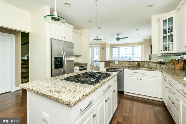 a view of a bathroom with a tub and shower
