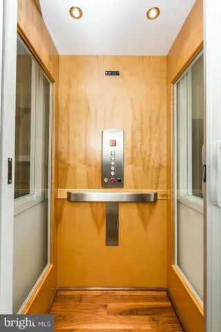 a bedroom with a bed and balcony