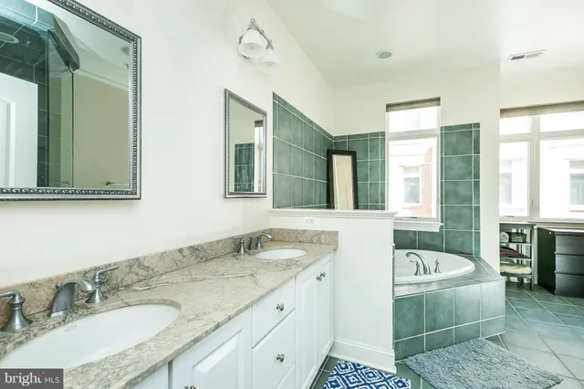 a bathroom with a bathtub and a shower