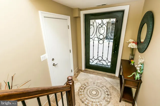a view of a dining room with furniture wooden floor and a chandelier