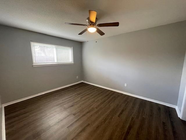 605 Patterson Street, Unit 9 Memphis, TN 38111 - Photo 8 of 10 an empty room with wooden floor ceiling fan and windows