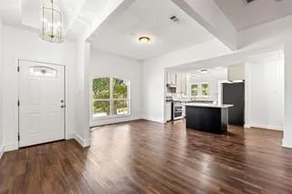 a view of kitchen with cabinets and wooden floor