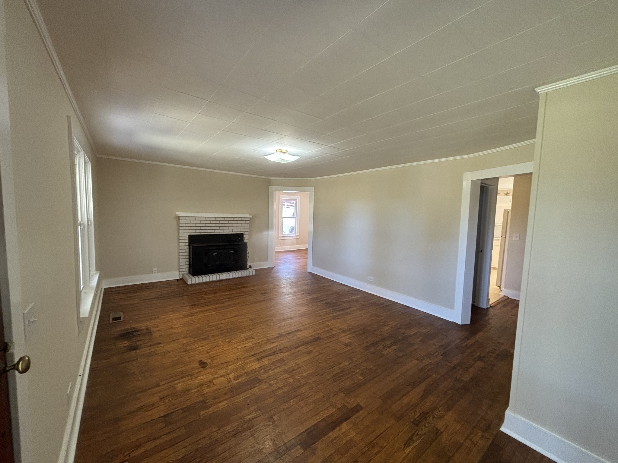 1893 Briar Patch Road Prospect, TN 38477 - Photo 16 of 43 an empty room with wooden floor and fireplace