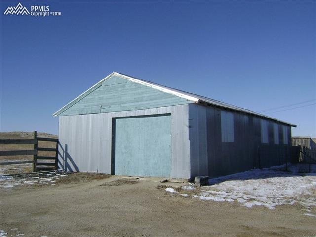 19820 Sakala Road Calhan, CO 80808 - Photo 22 of 30 garage with shop and craft room in back
