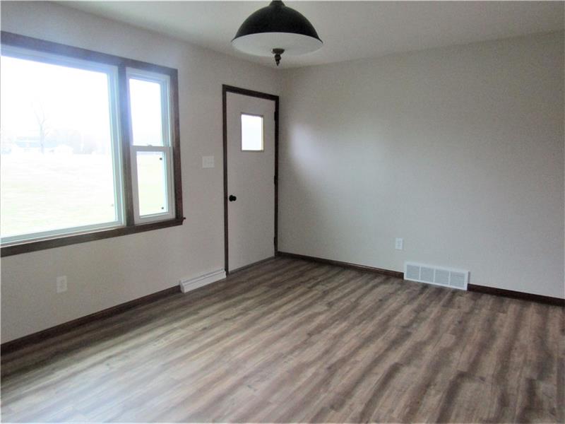 2793 Wampum Road Wampum, PA 16157 - Photo 8 of 19 Living room with nice big window with plenty of natural light and new light fixture.