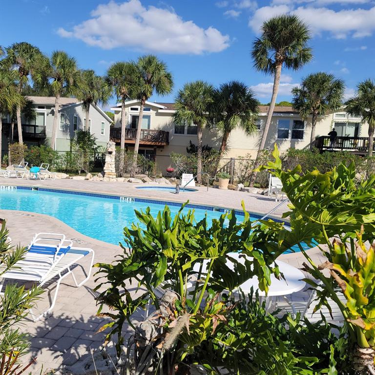7644 Sailwinds Pass Port Richey, FL 34668 - Photo 2 of 22 a view of a house with a yard and garden