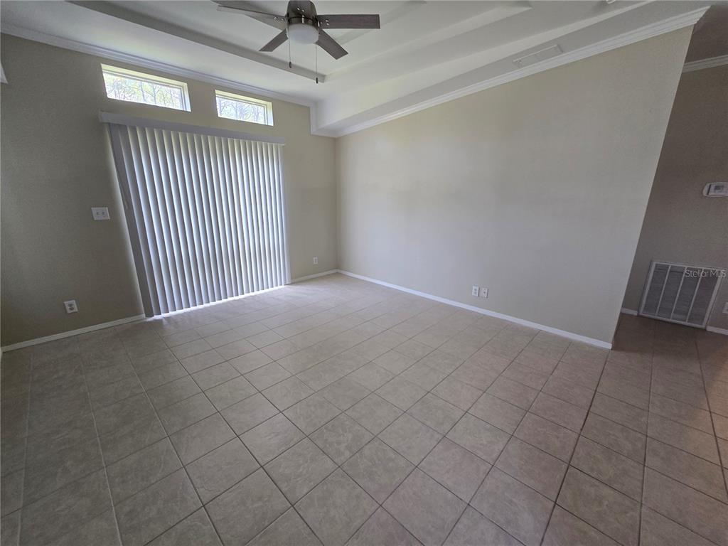 7644 Sailwinds Pass Port Richey, FL 34668 - Photo 5 of 22 en empty room with windows