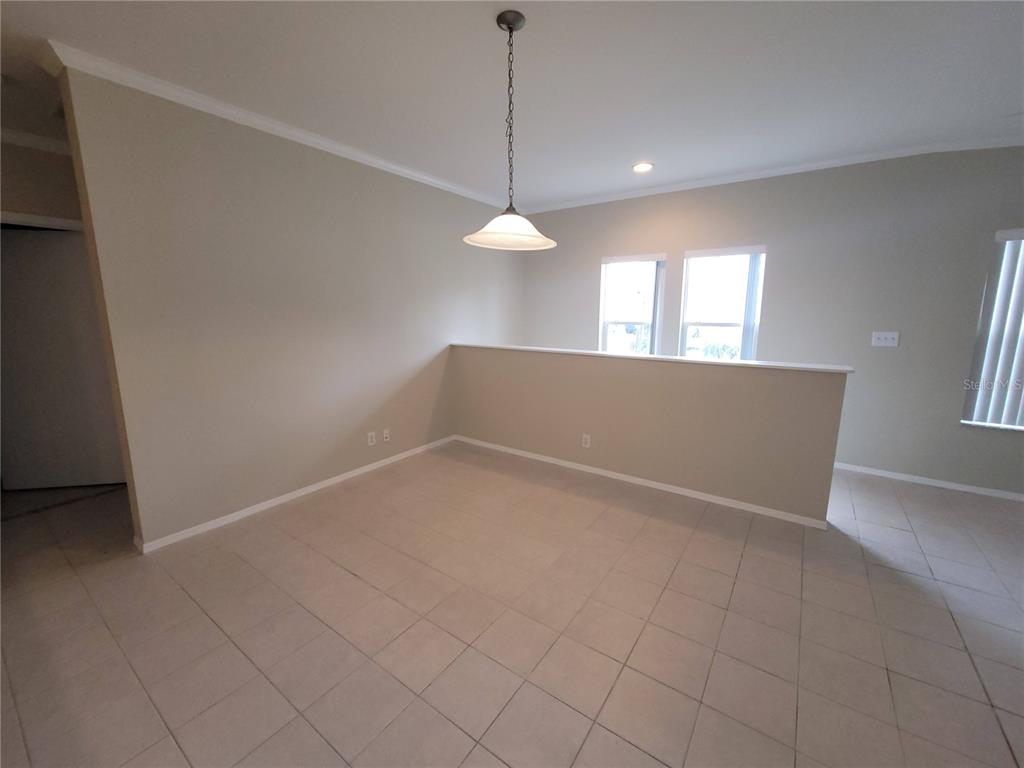 7644 Sailwinds Pass Port Richey, FL 34668 - Photo 6 of 22 a view of an empty room with a window