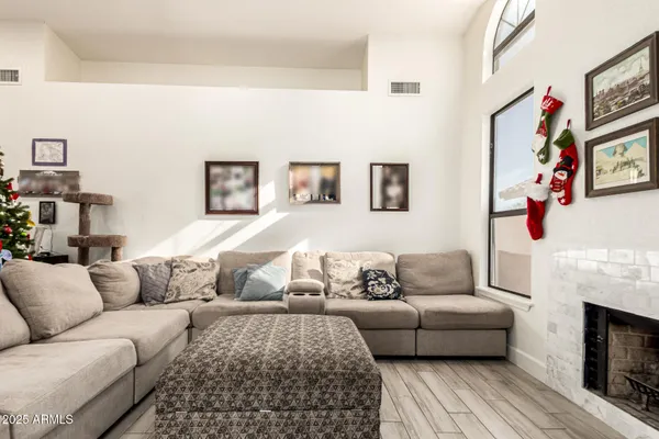 a living room with furniture a couch and a fireplace