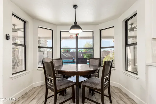 a dining room with furniture and window