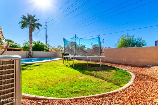 a view of a swimming pool with a patio
