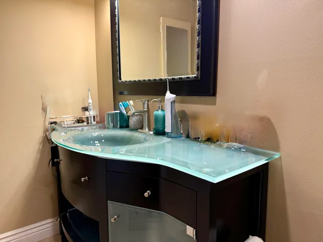 a bathroom with a sink and a mirror