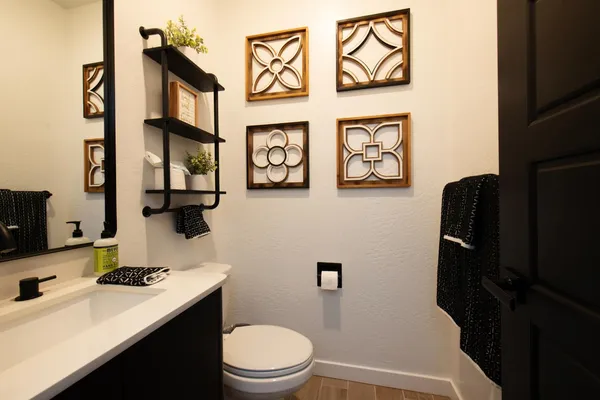 a bathroom with a sink toilet and window