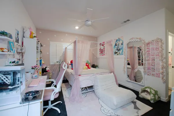 a room with furniture a rug and white walls