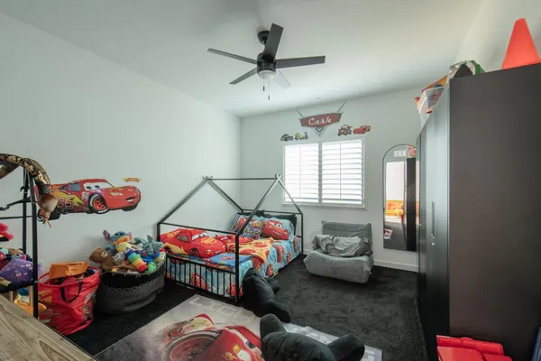 a bedroom with furniture and a window
