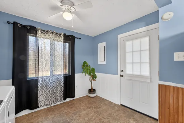 a view of an empty room with a window