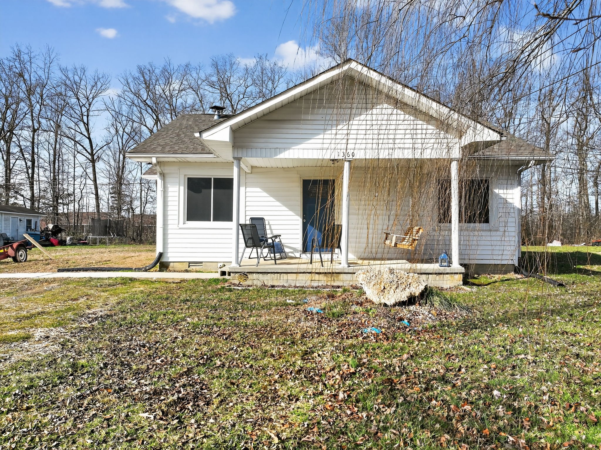 1360 Dunavin Drive Baxter, TN 38544 - Photo 17 of 24 a front view of a house with garden