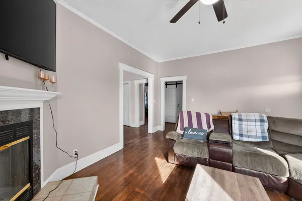 a living room with furniture and a fireplace