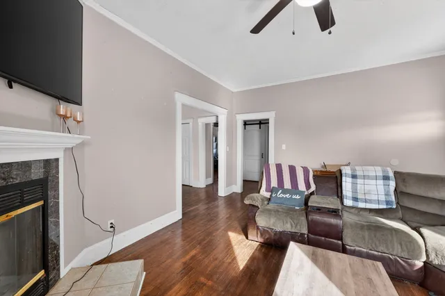 a living room with furniture and a fireplace